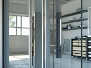 Modern Glass Garage Door Installation La Mesa Sleek modern glass garage door with sturdy aluminum frame, brightening a contemporary garage interior in La Mesa.